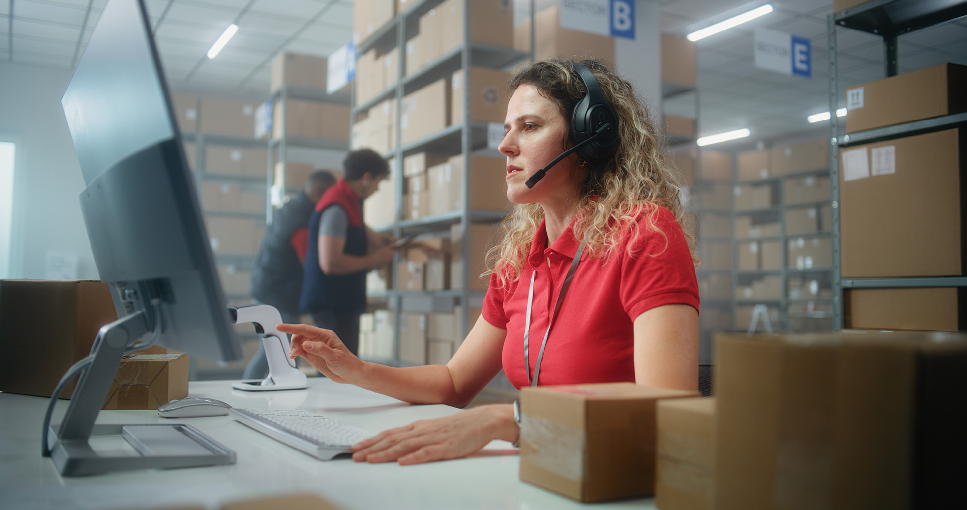Female specialist in logistics processing an ocean booking on a desktop computer