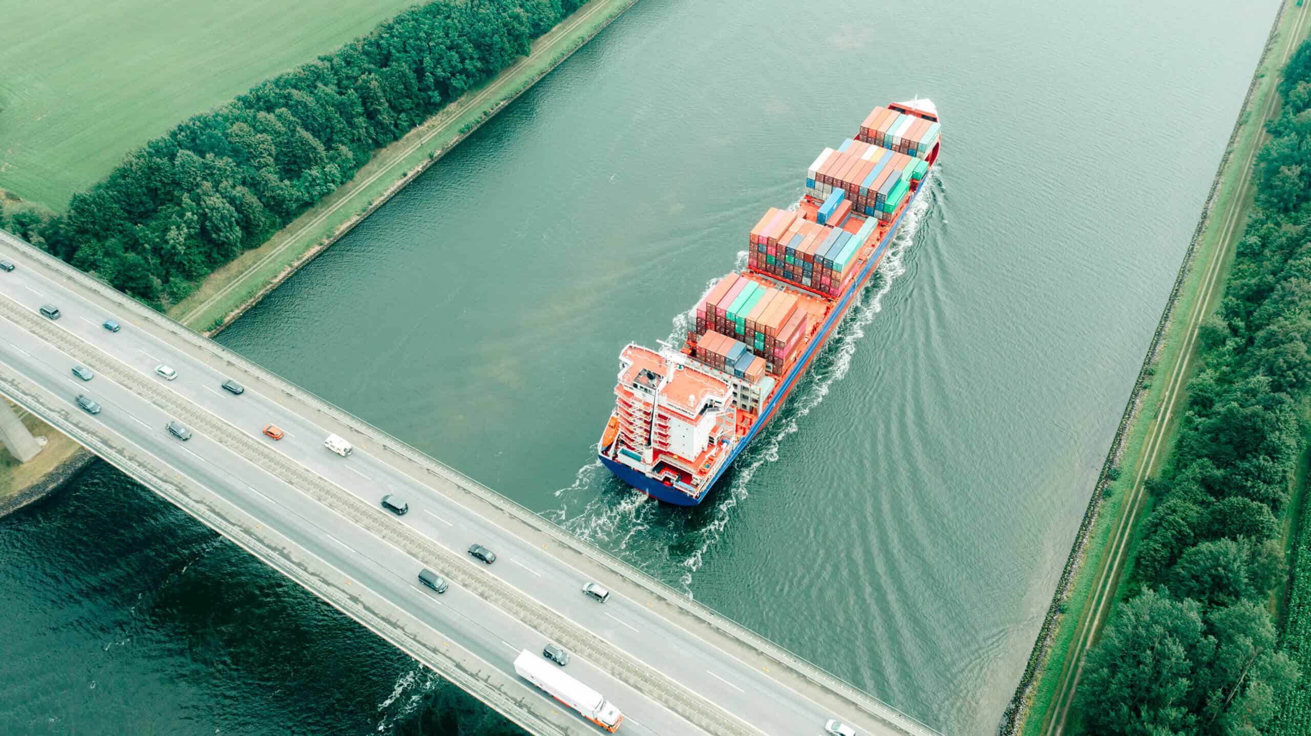 An aerial view of a container ship and on the Audorfer See - stock photo