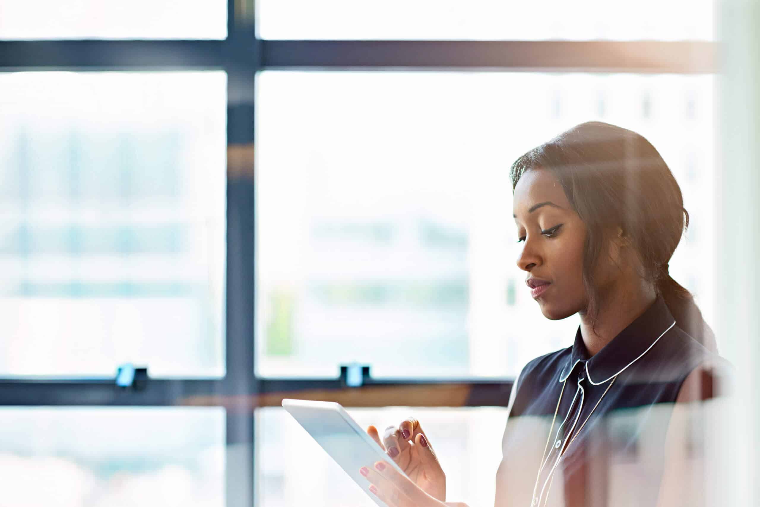 Businesswoman using a digital tablet in office