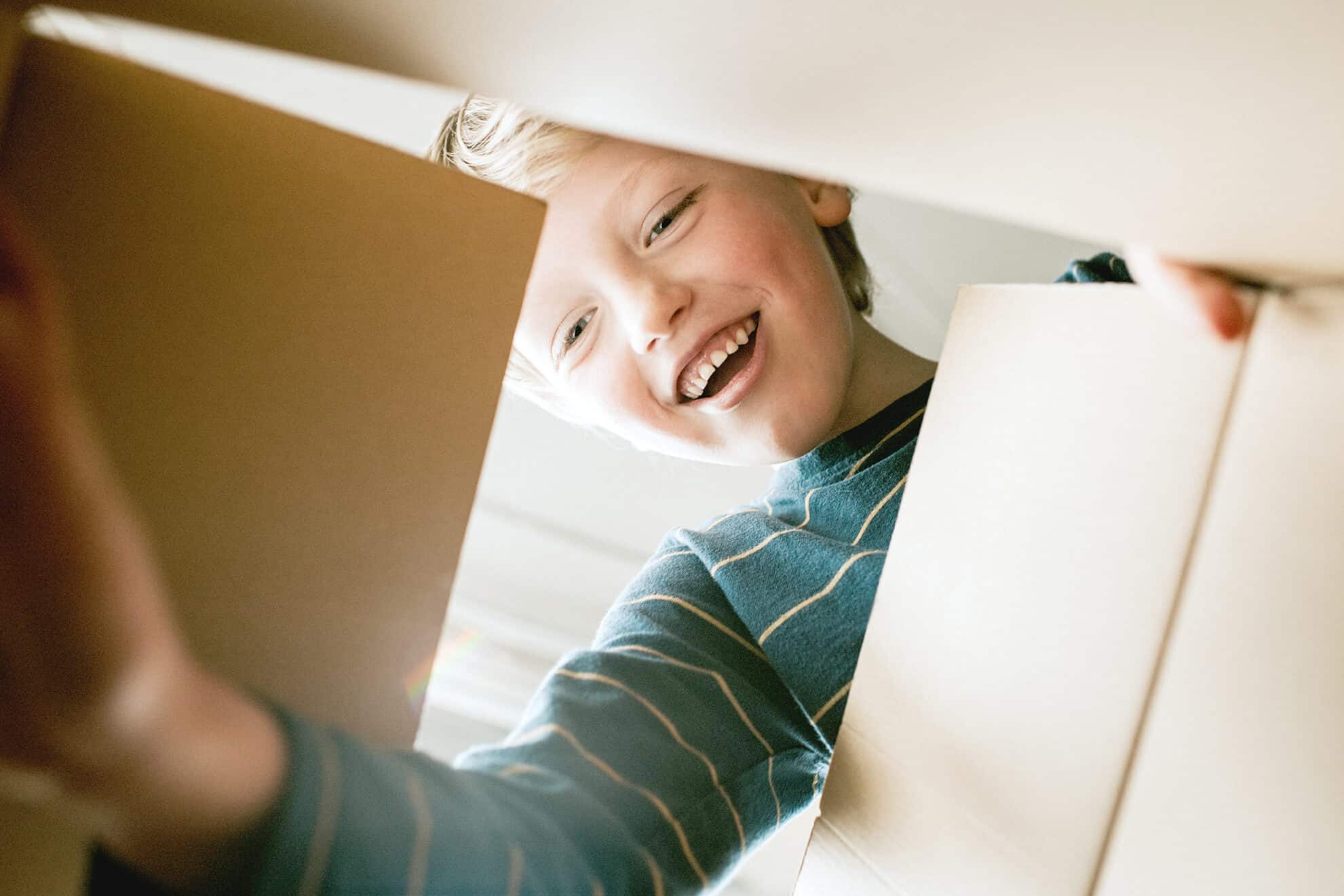 Happy Boy looking into a Box