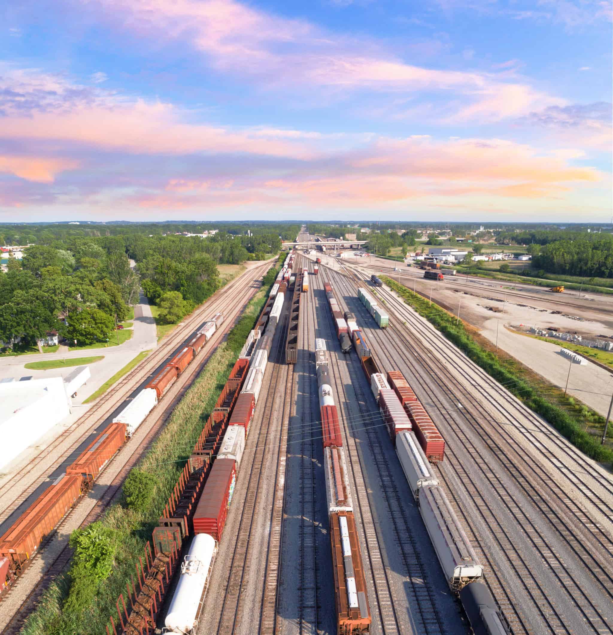 aerial view of railroad rail yard, many trains, tracks.