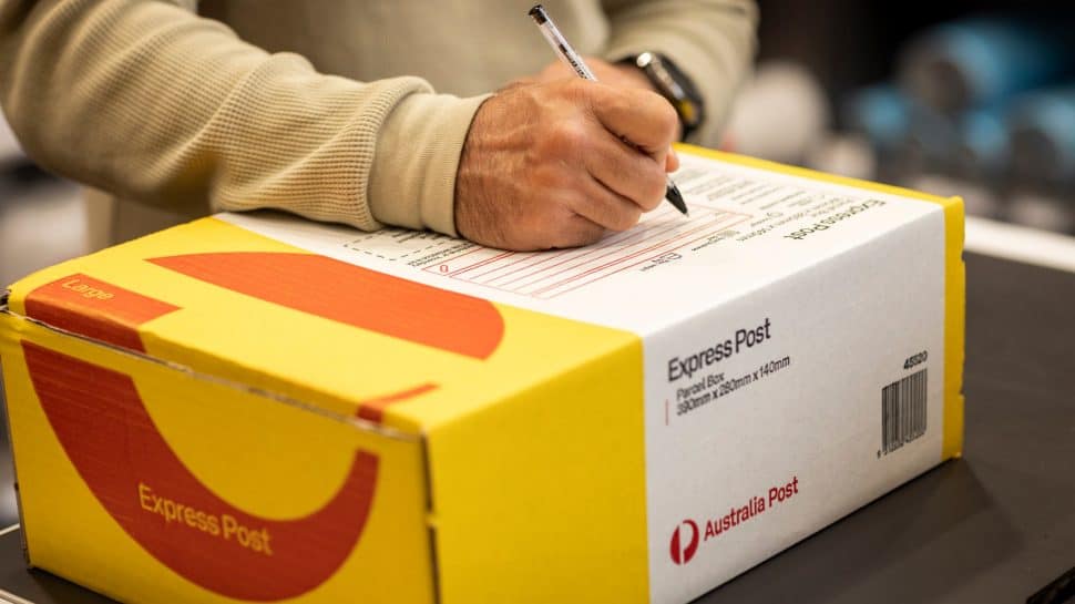 photo-man-signing-express-post-box.jpg.auspostimage.970_0.169.medium