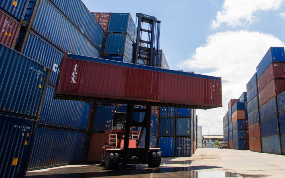 Container Being Lifted By Forklift