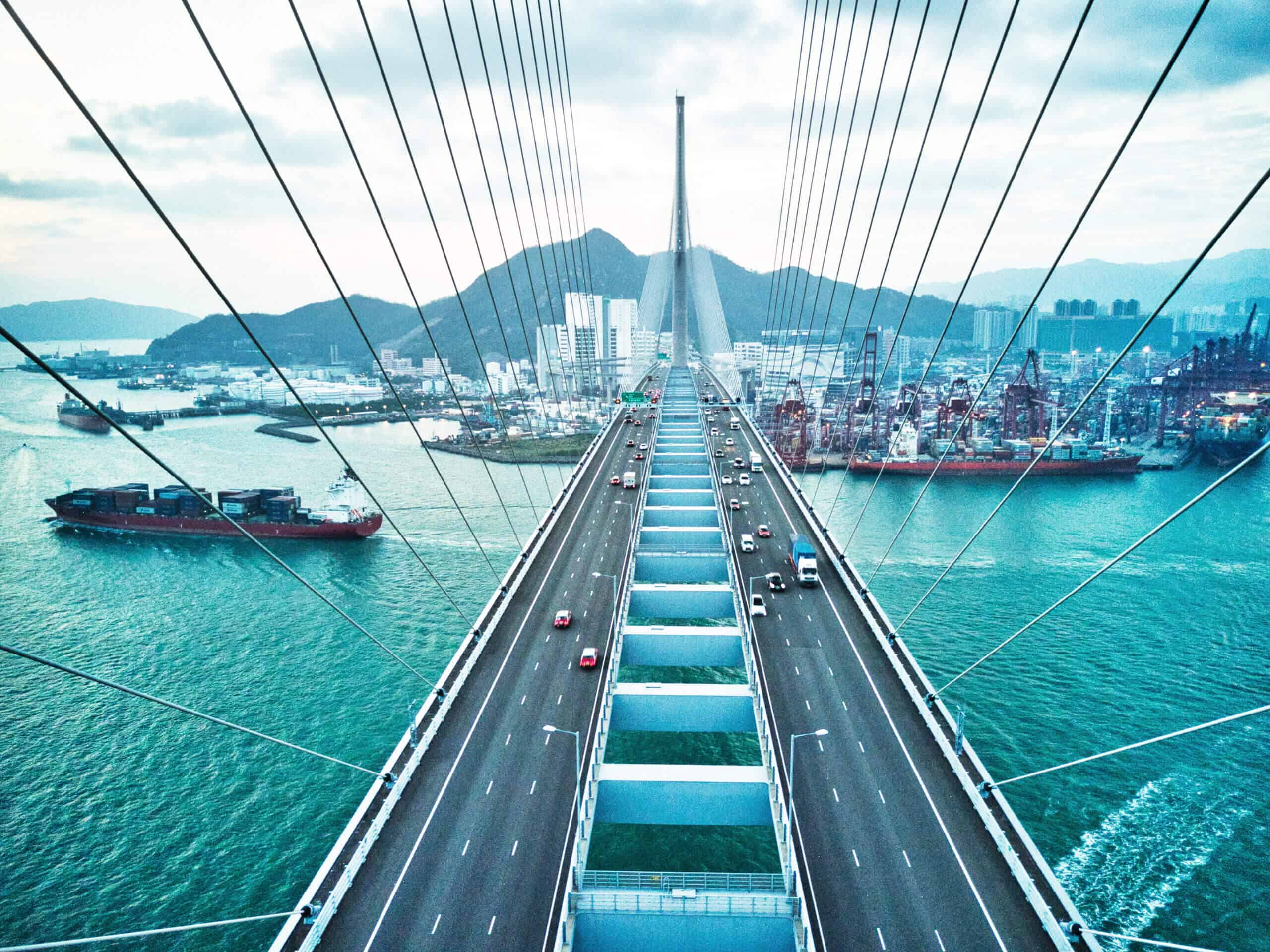 Bridge in Hong Kong and Container Cargo freight ship