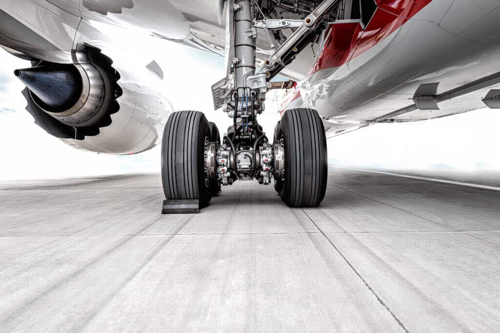 The huge wheels of the plane were parked on the runway of the airport Boeing 787 global supply chain management takes flight