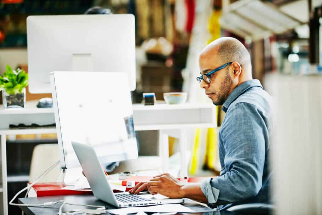 Businessman at workstation in startup office Planning