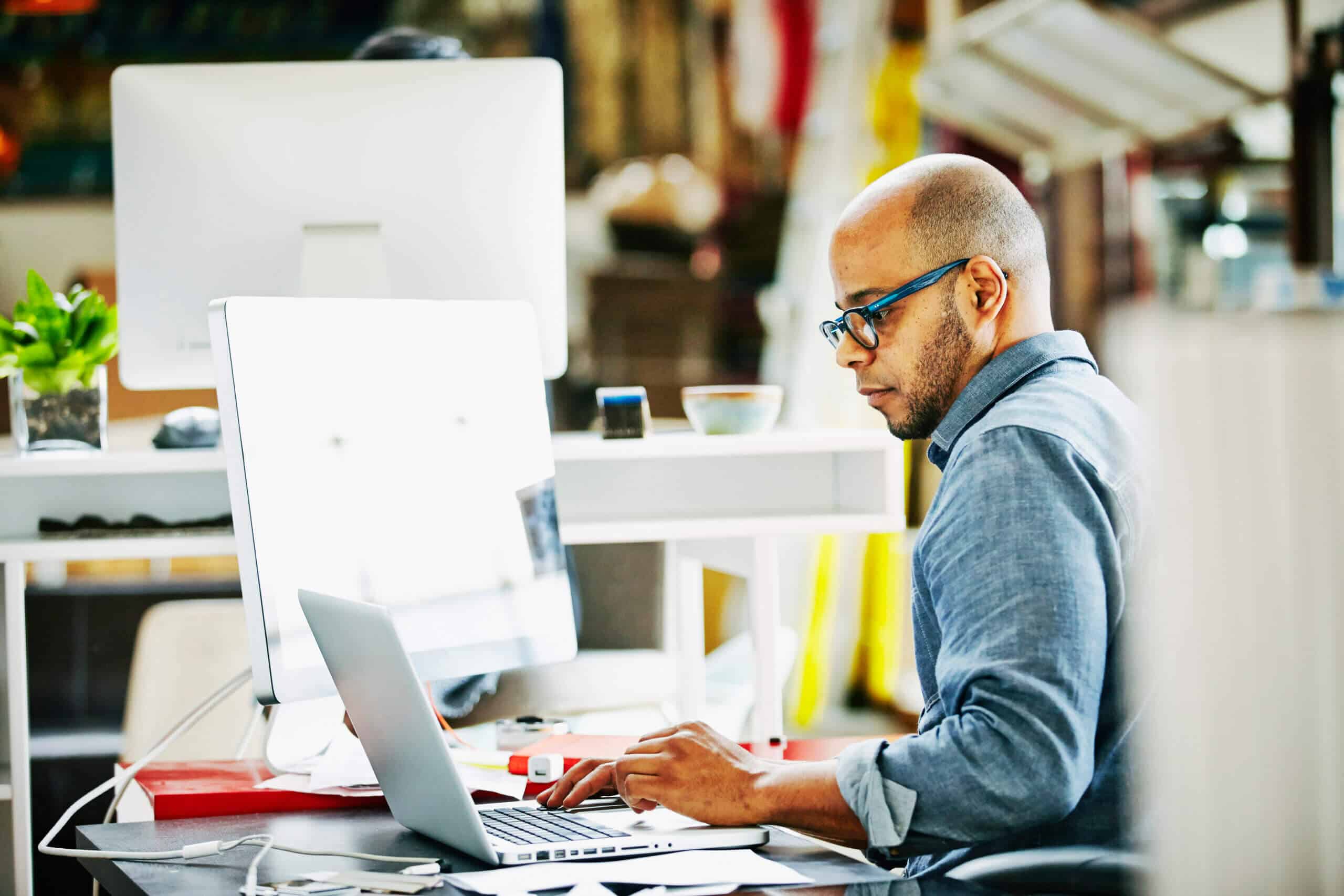 Businessman at workstation in startup office