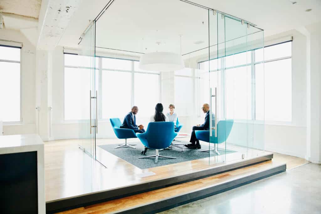 Businesspeople discussing project in office Businesspeople discussing project in office