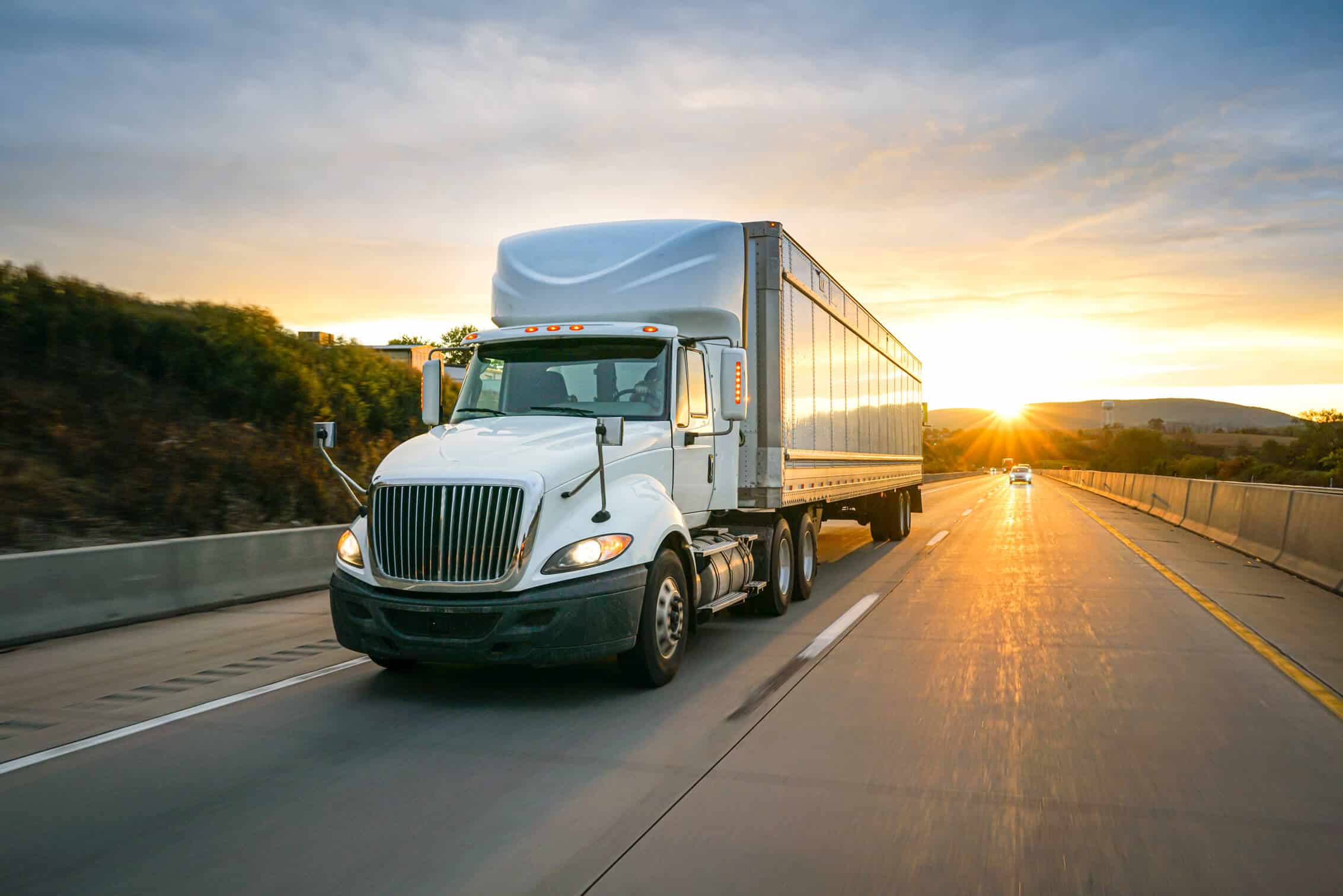 Freight transportation truck on the road at golden hour