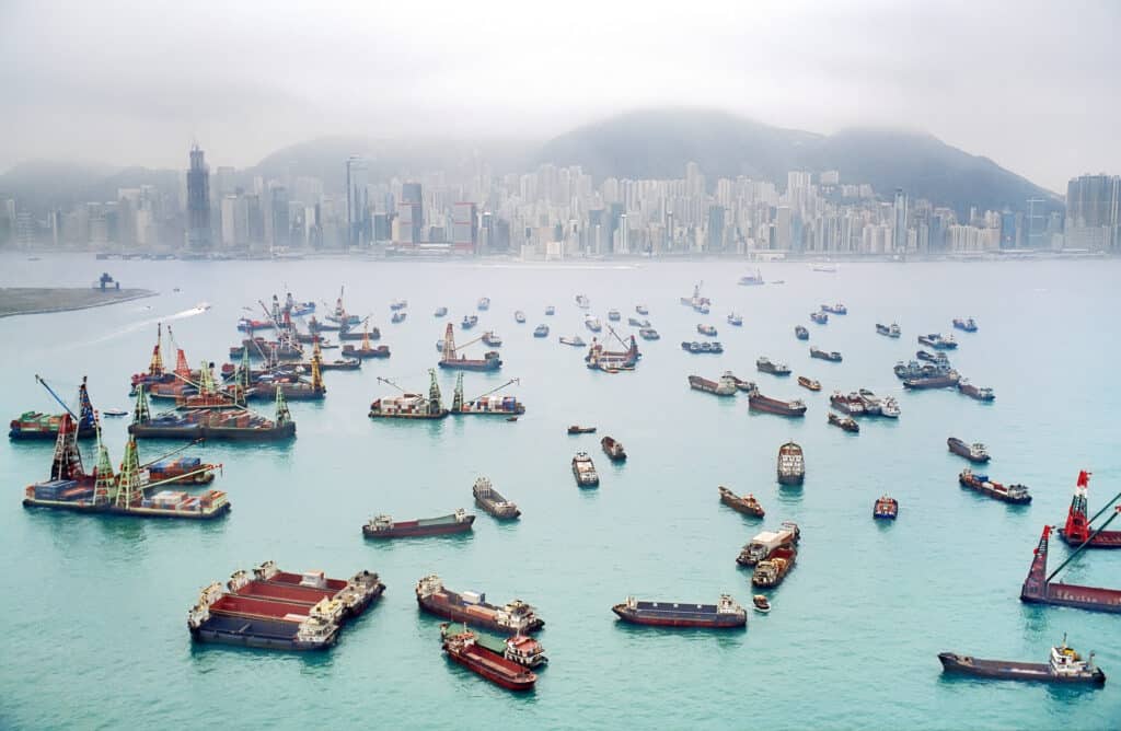 A view of Hong Kong Harbor through a cloudy haze Global Trade Managed Services