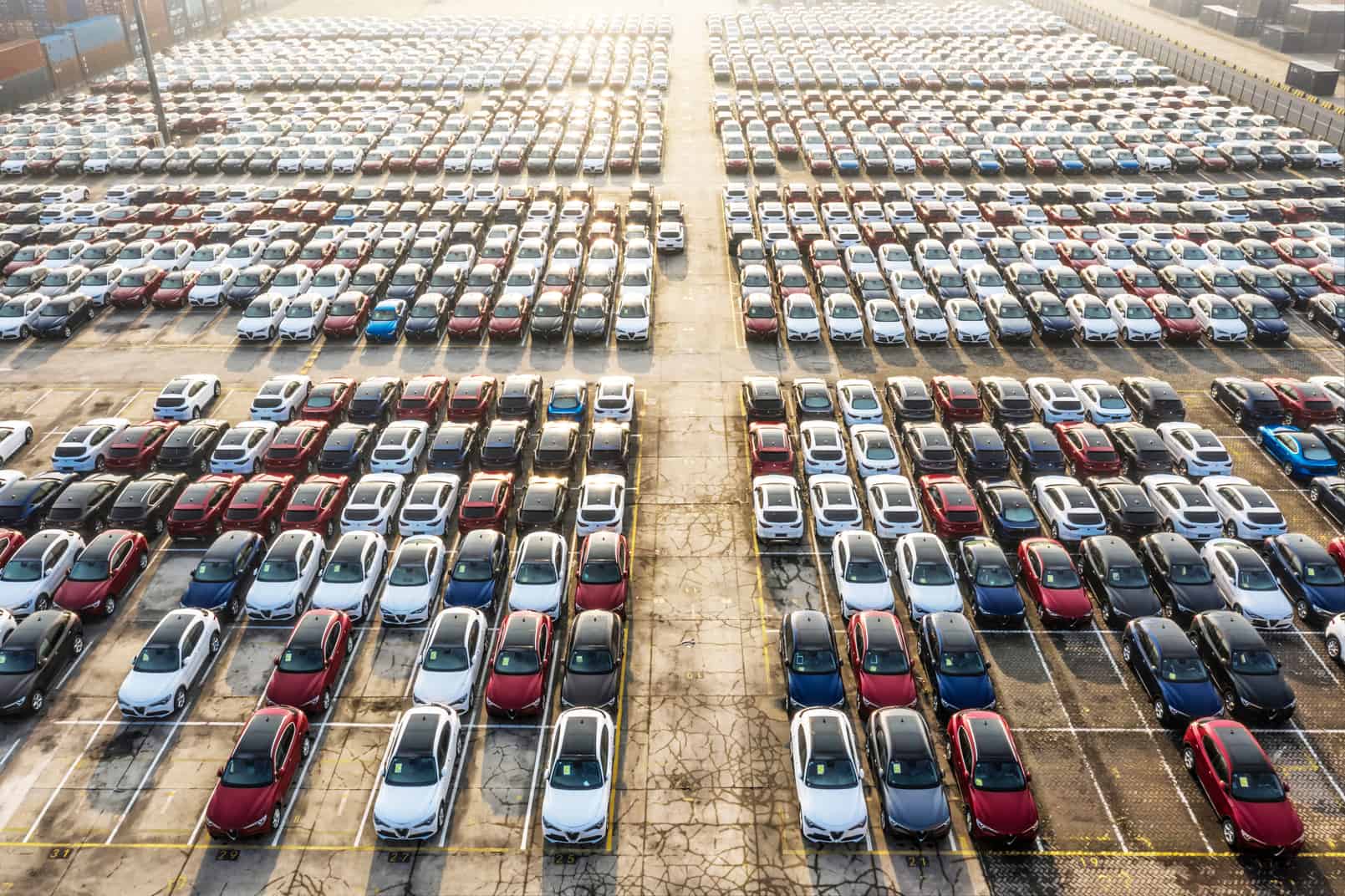 Aerial view new cars lined up in the port for import and export