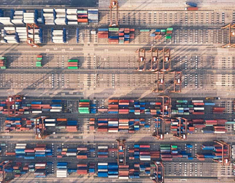 Aerial top view Container cargo warehouse at Terminal commercial port for business logistics, import export, shipping or freight transportation.