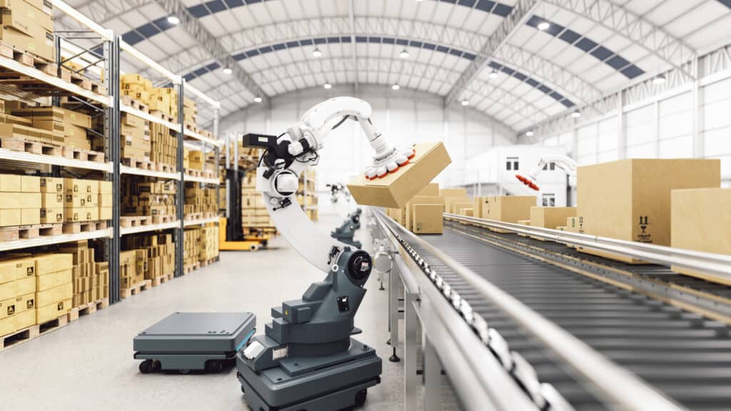 GettyImages-1341262391-72dpi Automation with AGV and robotic arm in smart distribution warehouse.