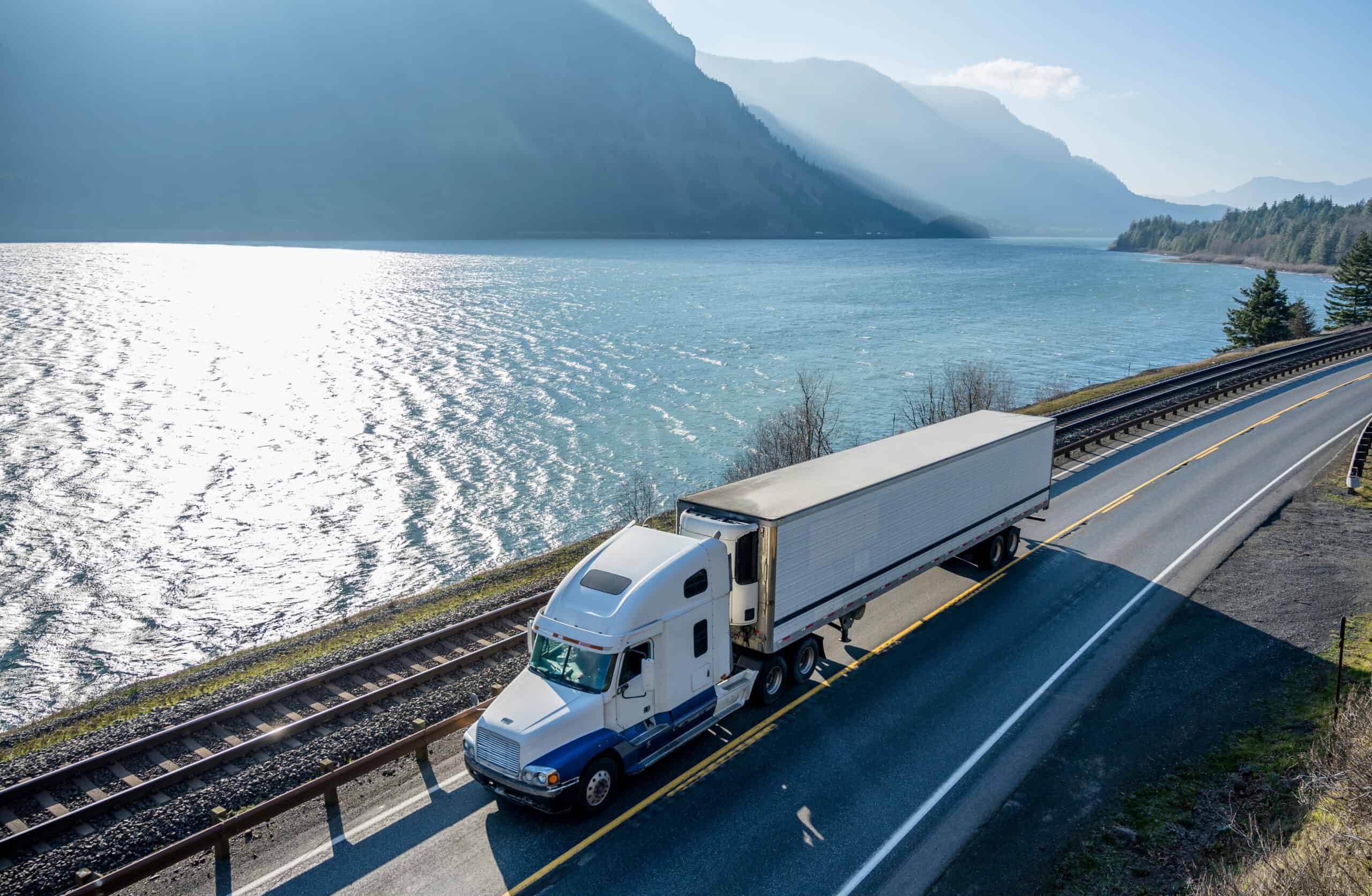 Big,rig,classic,american,powerful,white,semi,truck,with,refrigerated