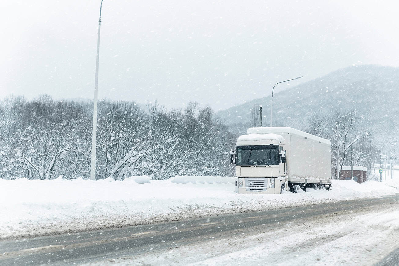 Big,commercial,semi Trailer,truck,trapped,in,snow,drift,on,closed