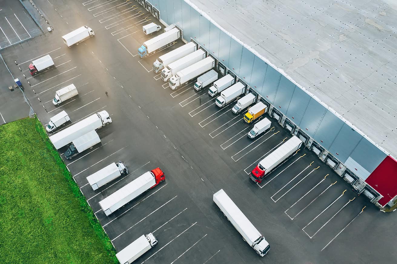 Aerial,view,of,many,trucks,at,the,loading,docks,of